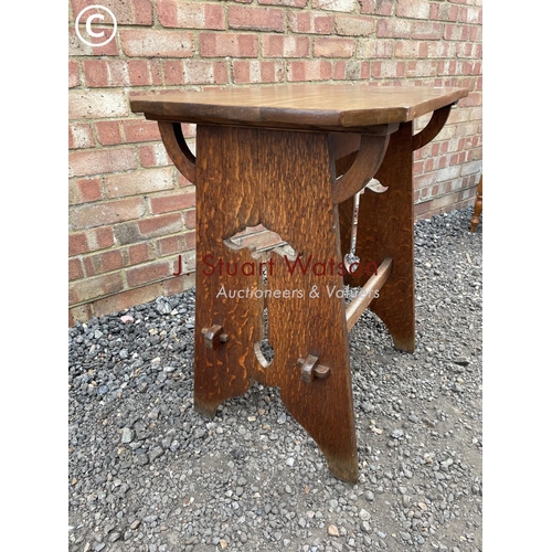 214 - A 20th century oak arts and crafts occasional table 70x48x76