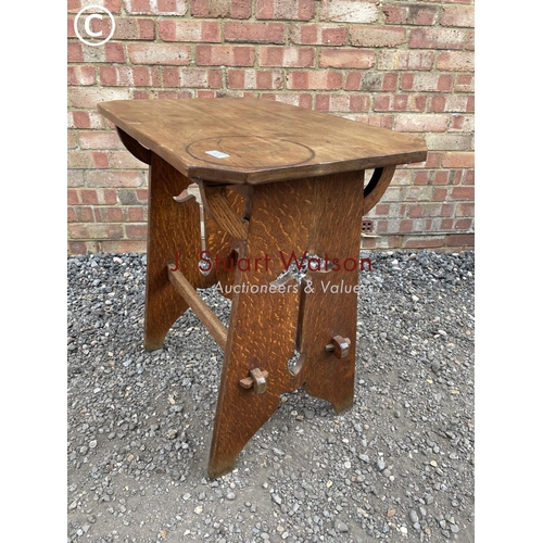 214 - A 20th century oak arts and crafts occasional table 70x48x76