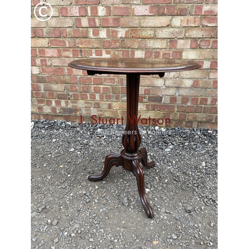 215 - A Victorian mahogany snap top occasional table inlaid with floral patterns to the top