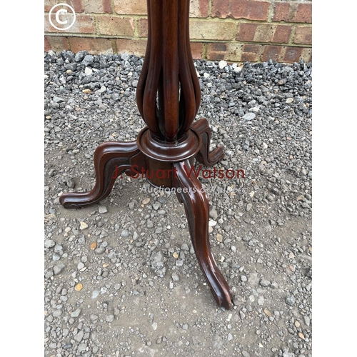 215 - A Victorian mahogany snap top occasional table inlaid with floral patterns to the top