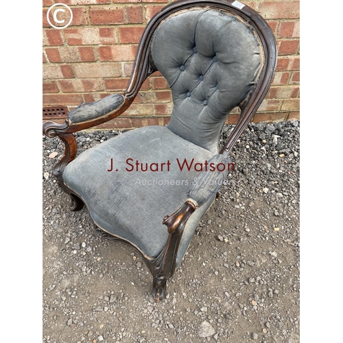 218 - An early Victorian blue upholstered button back nursing chair