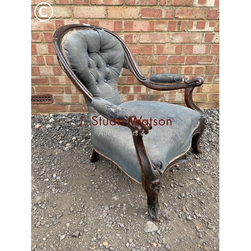 218 - An early Victorian blue upholstered button back nursing chair