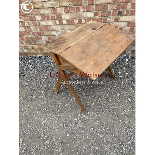 232 - A vintage school desk with fold over top