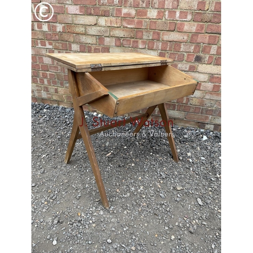 232 - A vintage school desk with fold over top