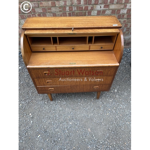 238 - A mid century teak danish style cylinder bureau with a fitted interior