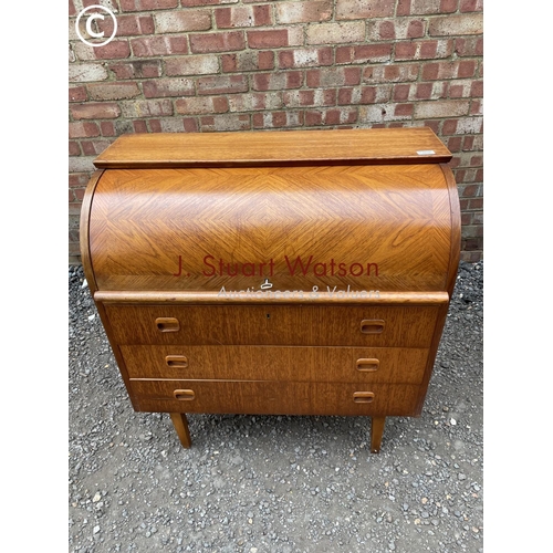 238 - A mid century teak danish style cylinder bureau with a fitted interior