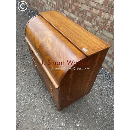 238 - A mid century teak danish style cylinder bureau with a fitted interior