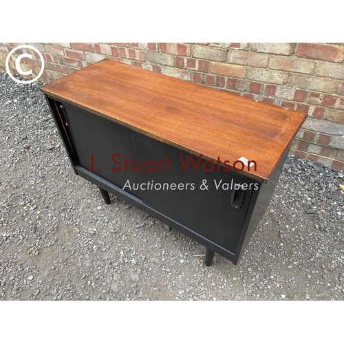 240 - A black painted teak record cupboard