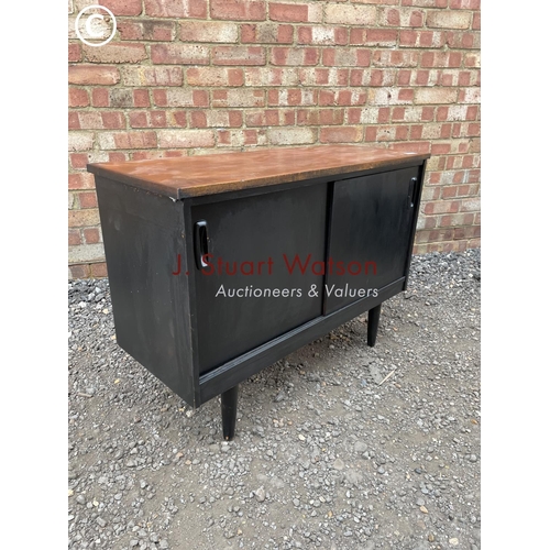 240 - A black painted teak record cupboard