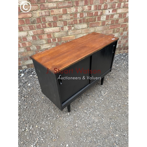 240 - A black painted teak record cupboard