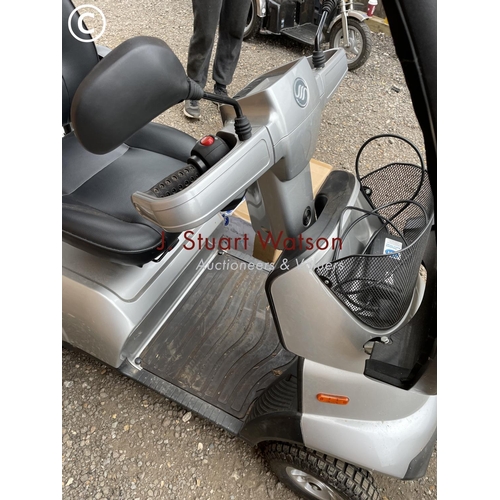 247 - A TGA Mobility scooter with canopy top cover, additional wet weather side cover, keys and charger in... 