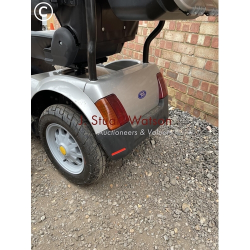 247 - A TGA Mobility scooter with canopy top cover, additional wet weather side cover, keys and charger in... 