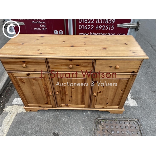 268 - A pine three drawer sideboard