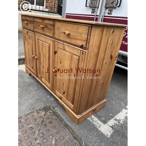 268 - A pine three drawer sideboard