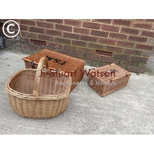 281 - Two Fortnum and Masons wicker baskets together with a shopping basket