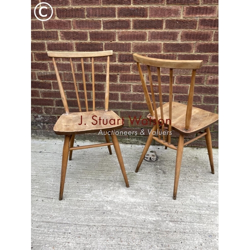 285 - A pair of Ercol light elm kitchen chairs