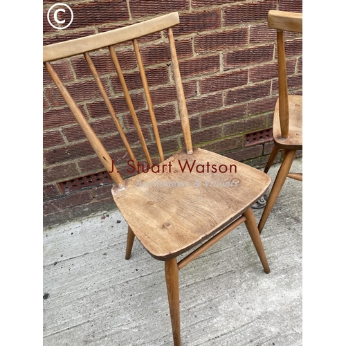 285 - A pair of Ercol light elm kitchen chairs