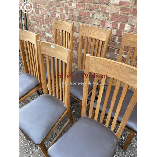 29 - A set of six modern light oak dining chairs