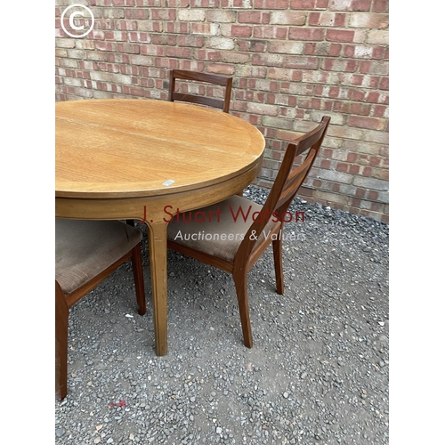 294 - A Nathan teak extending table and four chairs