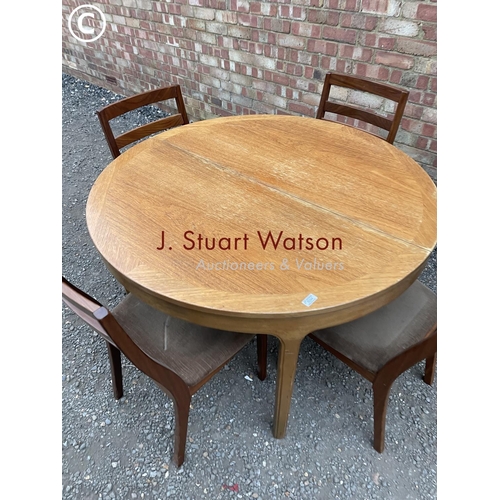 294 - A Nathan teak extending table and four chairs