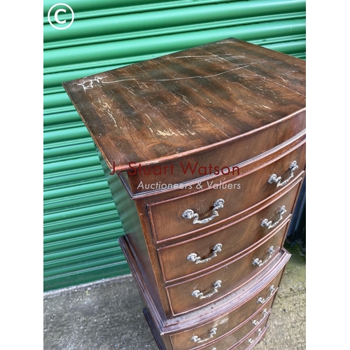 297 - A reproduction mahogany tallboy chest of six drawers