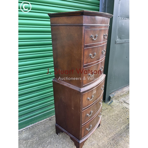 297 - A reproduction mahogany tallboy chest of six drawers