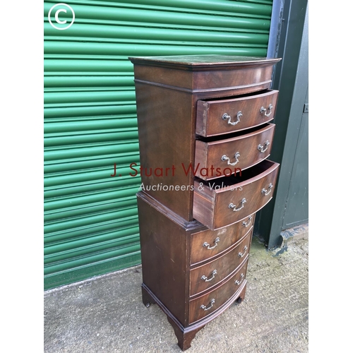 297 - A reproduction mahogany tallboy chest of six drawers