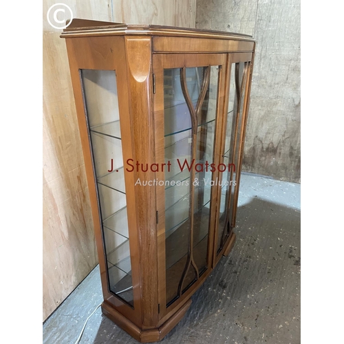 324 - A 1930's walnut display cabinet with four glass shelves