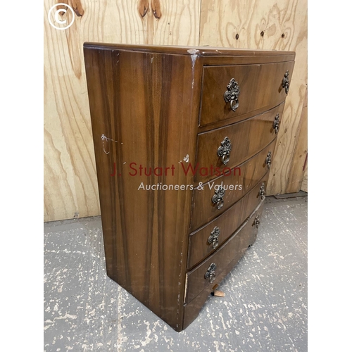 359 - A walnut veneered tallboy chest of five