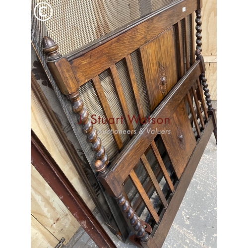 360 - An early 20th century oak barley twist bed frame