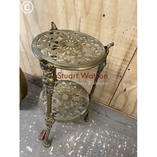 372 - An ornate brass trivet stand together with a brass warming pan