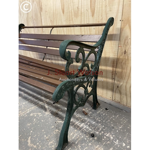 384 - An iron framed garden bench in need of refurbishment