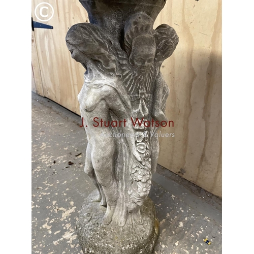 385 - A cast concrete pedestal bird bath decorated with three ladies 75 cm high