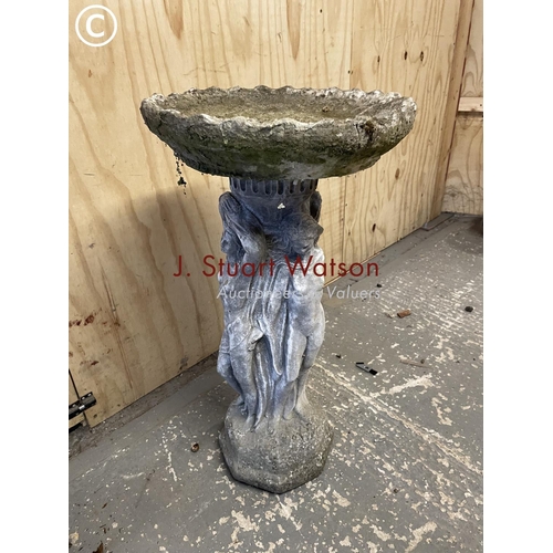 385 - A cast concrete pedestal bird bath decorated with three ladies 75 cm high