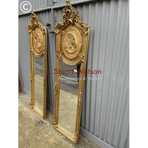 409 - A pair of highly or ornate  gold gilt hallway mirrors decorated with a lady and a gent each 180x48