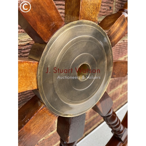 411 - A large 36 inch ships wheel with brass centre