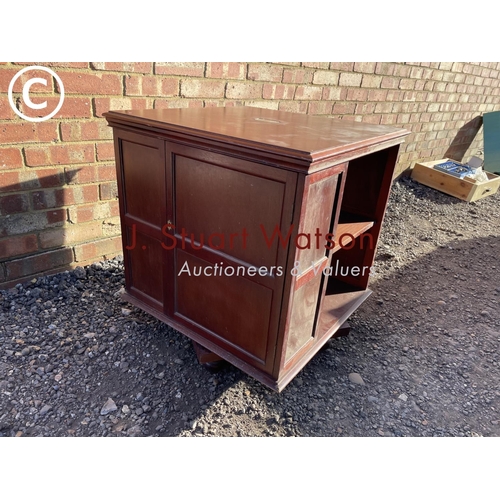 42 - A mahogany revolving book table