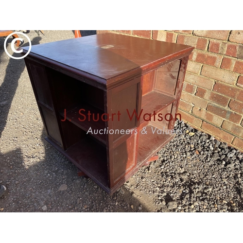 42 - A mahogany revolving book table