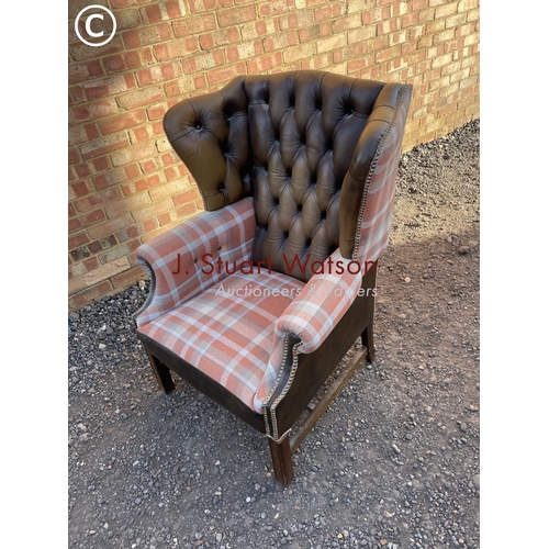 64 - A refurbished brown leather chesterfield wing back chair with tartan pattern wings