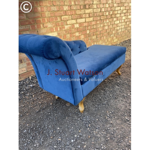 65 - A modern blue upholstered ottoman chaise lounge