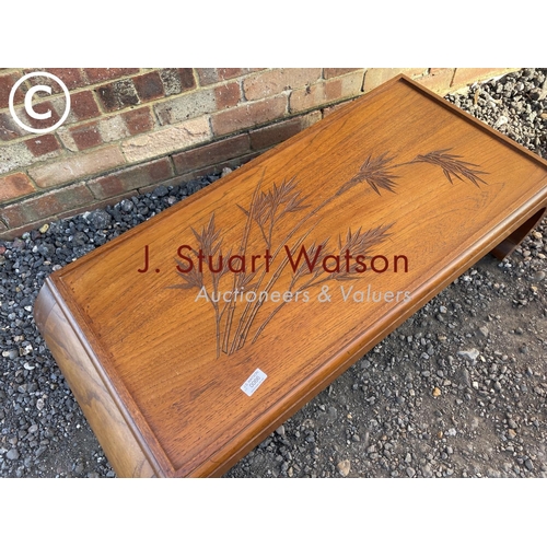 66 - An oriental hardwood coffee table