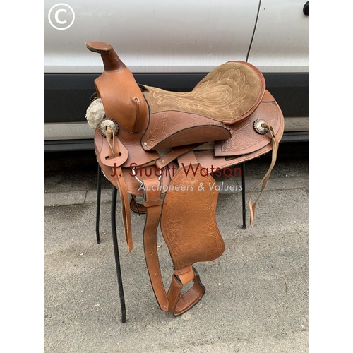 704 - Western style saddle, stand, cover and girth