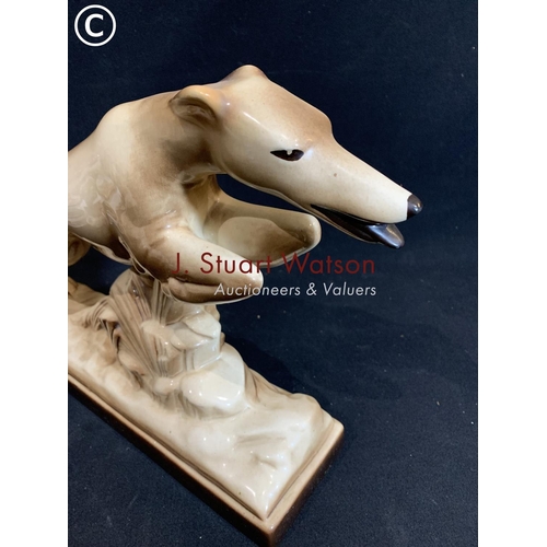 747 - S Radegonne leaping racing dog figure, length of base 38cms, height 29cms