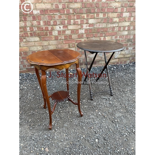 92 - A mahogany occasional table together with an oak folding table