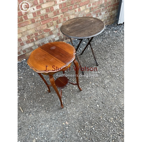 92 - A mahogany occasional table together with an oak folding table