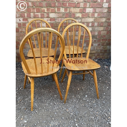 99 - A set of four elm stick back kitchen chairs