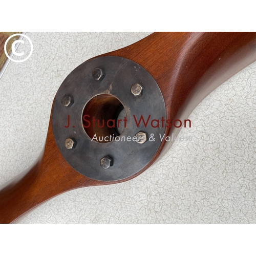 283 - A reproduction hardwood propeller 154cm long