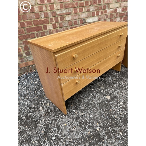 101 - A mid century chest of three together with matching blanket box