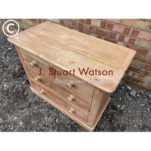 102 - A stripped pine chest of four drawers