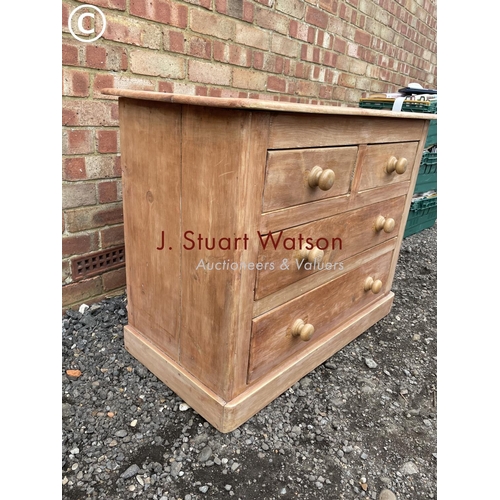 102 - A stripped pine chest of four drawers